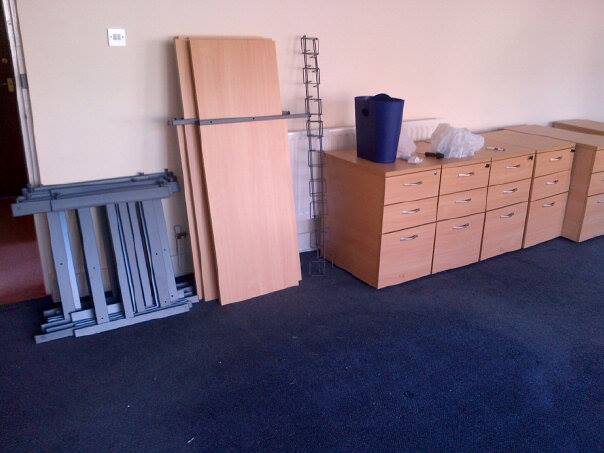 Flat packed desks ready to be moved